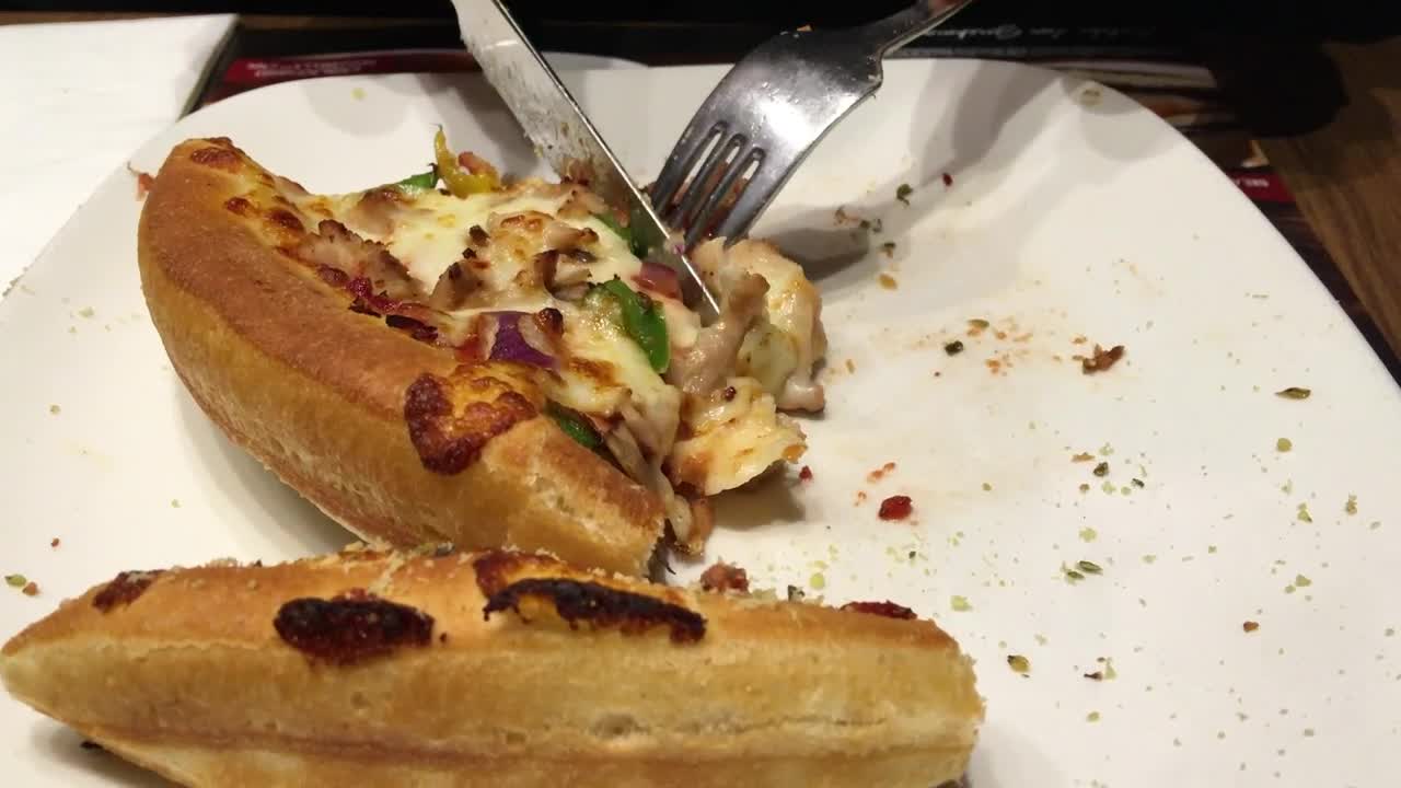 Stock Video Person Eating Pizza Using Cutlery Live Wallpaper