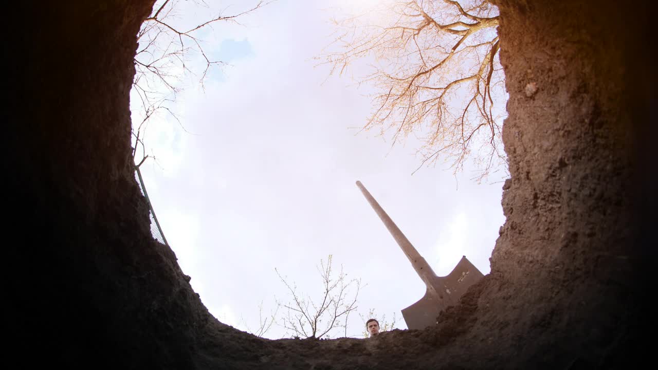 Stock Video Person Filling A Hole In The Ground Live Wallpaper