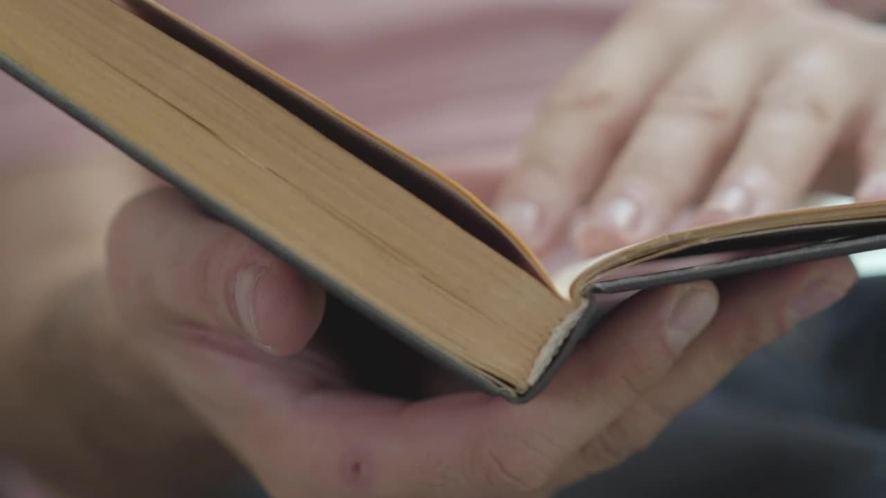 Stock Video Person Flipping Through A Book Looking For A Page Live Wallpaper