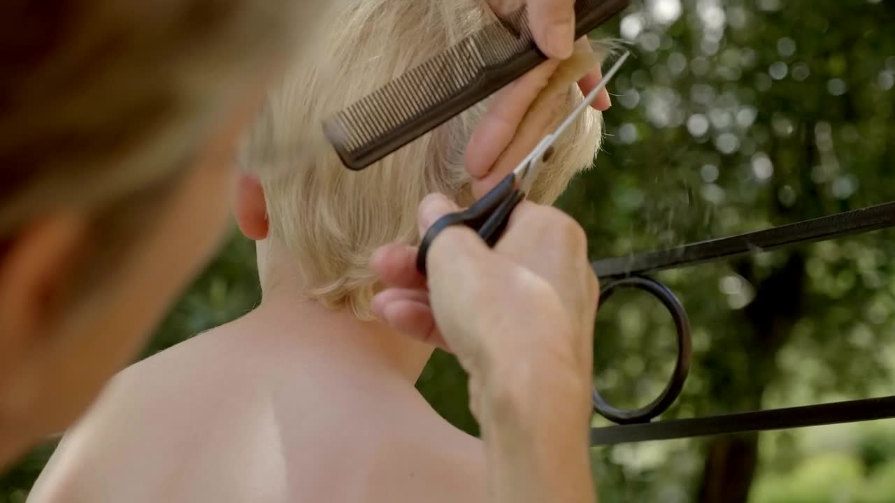 Stock Video Person Giving A Boy A Haircut Live Wallpaper