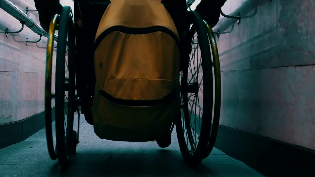 Stock Video Person In A Wheelchair Sliding Down A Narrow Slope Live Wallpaper