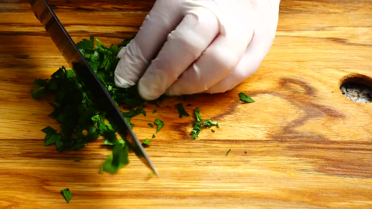 Stock Video Person In Gloves Cutting Parsley Live Wallpaper