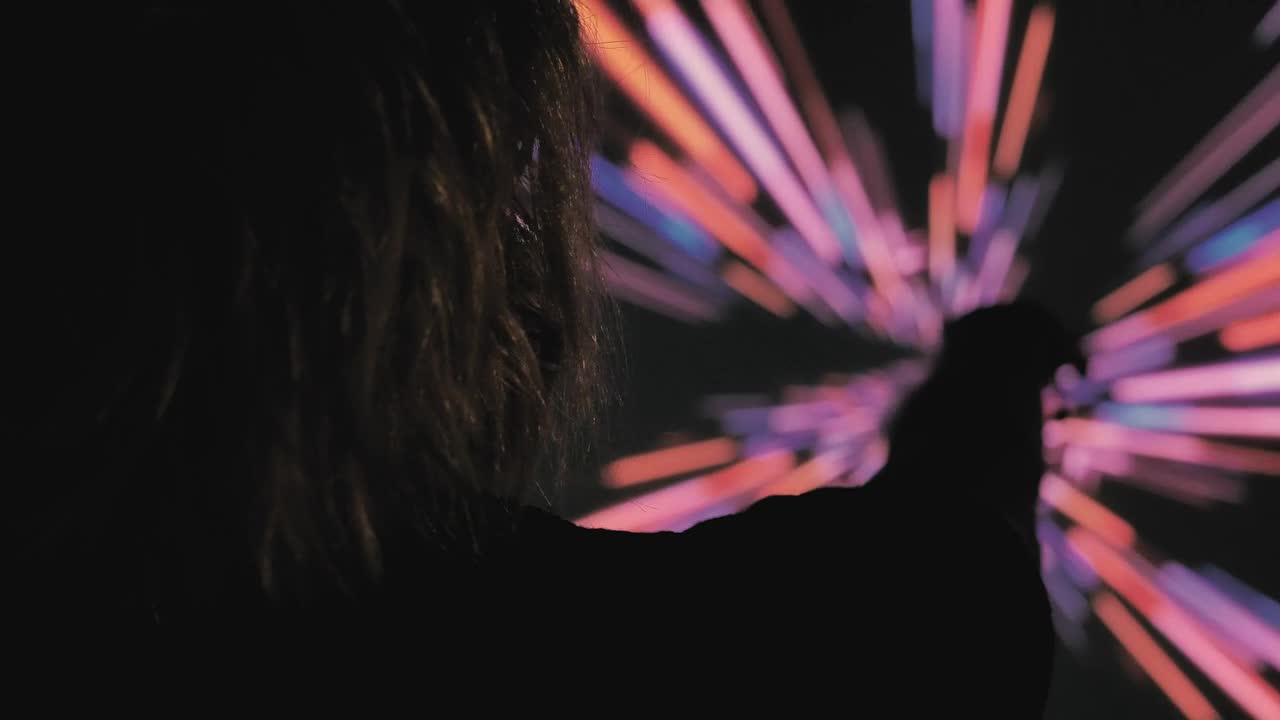 Stock Video Person In The Dark With A Colored Lights Background Live Wallpaper