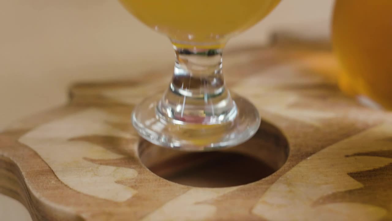 Stock Video Person Leaving A Beer Cup On A Wooden Board Live Wallpaper