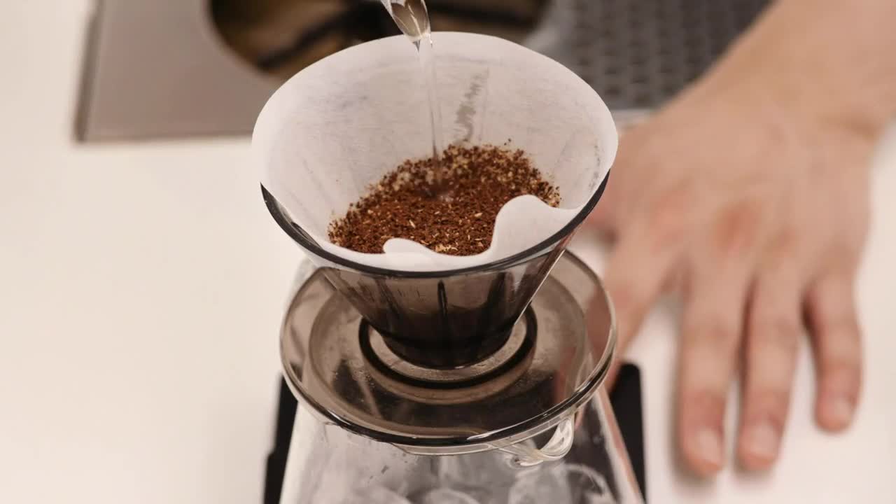 Stock Video Person Making A V Pour Over Coffee From Above Live Wallpaper