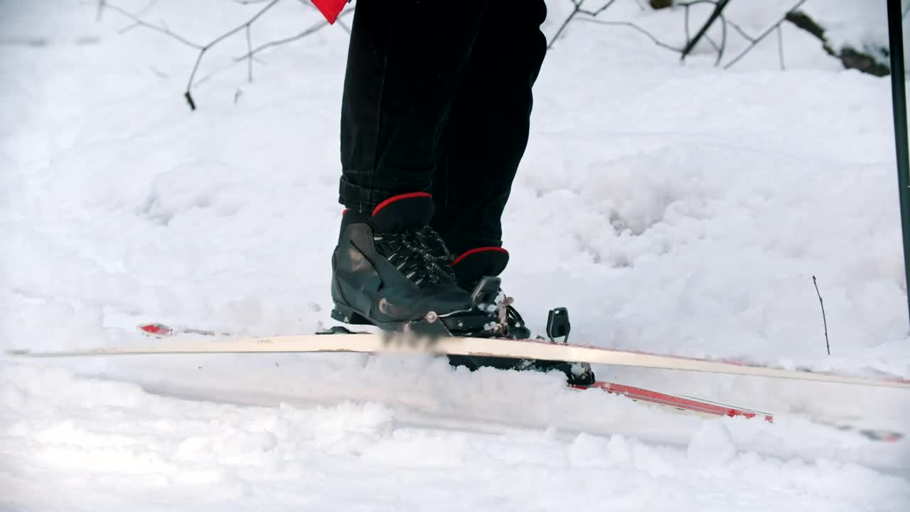 Stock Video Person On Snow Taking Off Skis Live Wallpaper