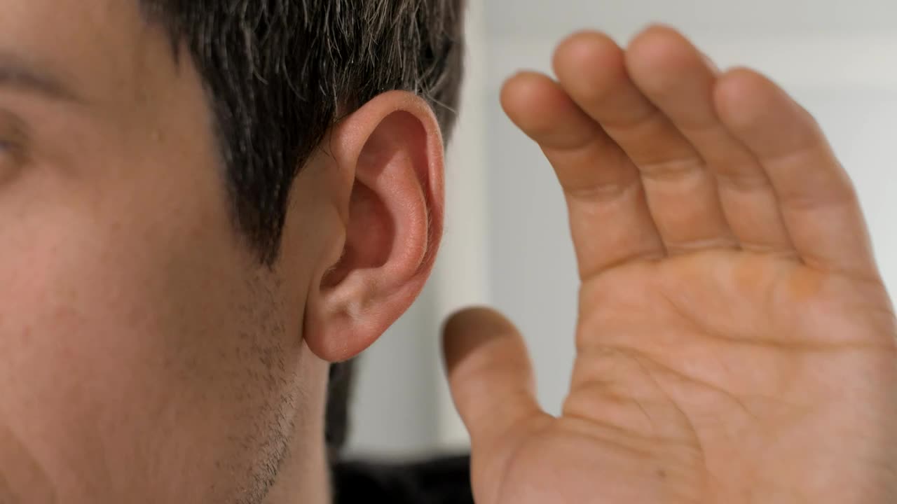 Stock Video Person Places His Hand On His Ear To Hear Better Live Wallpaper