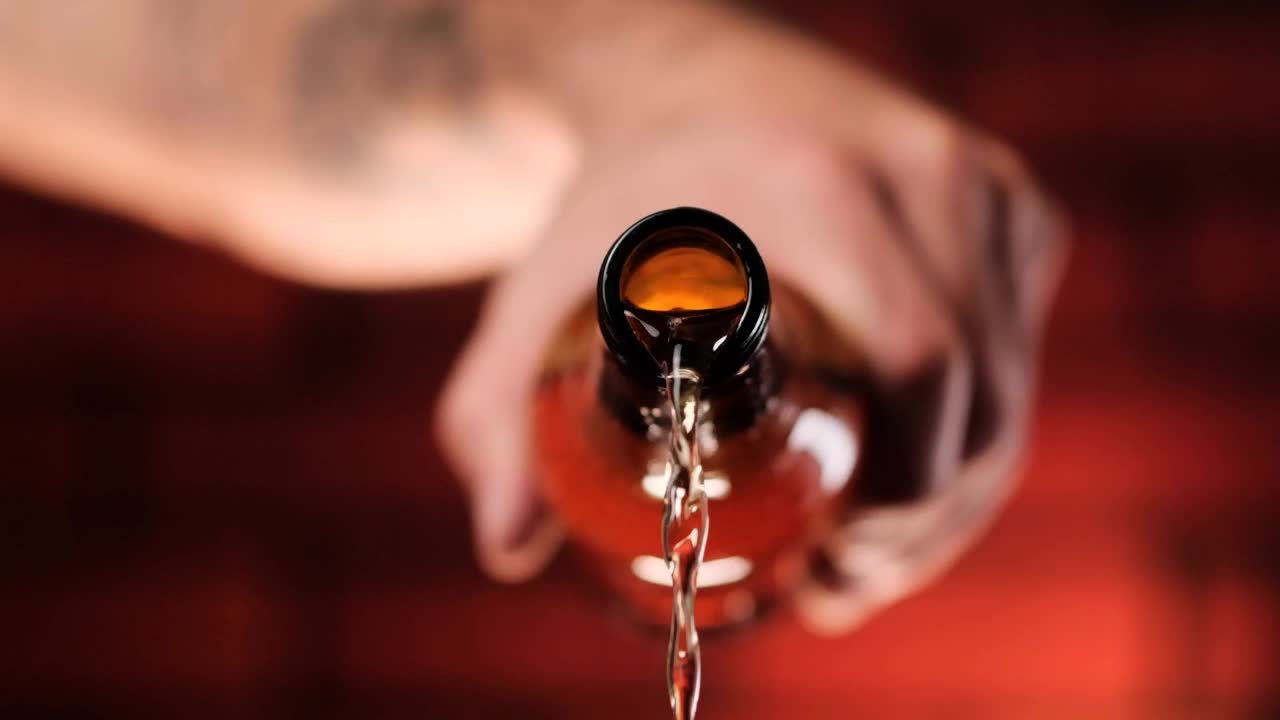 Video Stock Person Pouring Beer From A Glass Bottle Live Wallpaper Free