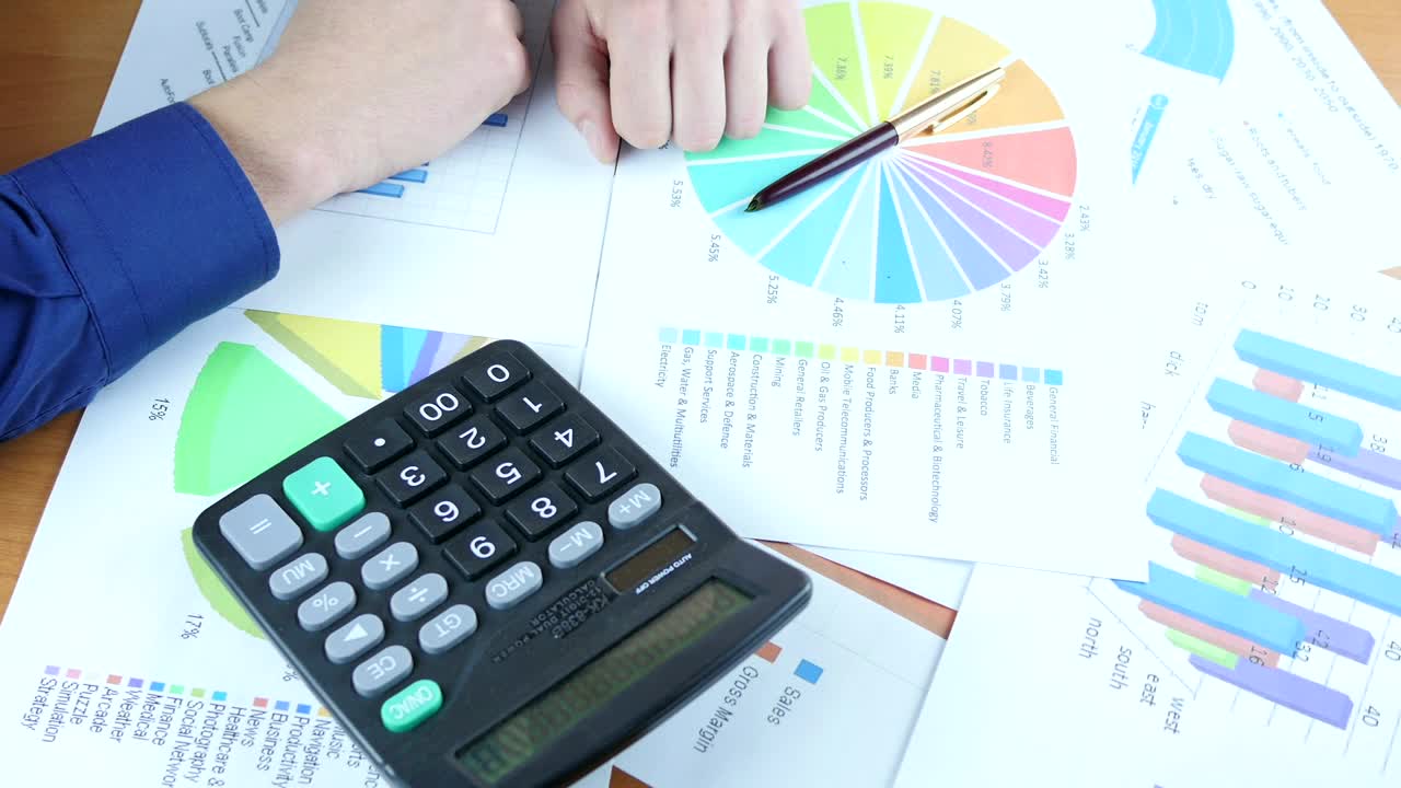Video Stock Person Reviewing Graphs On Paper Live Wallpaper Free