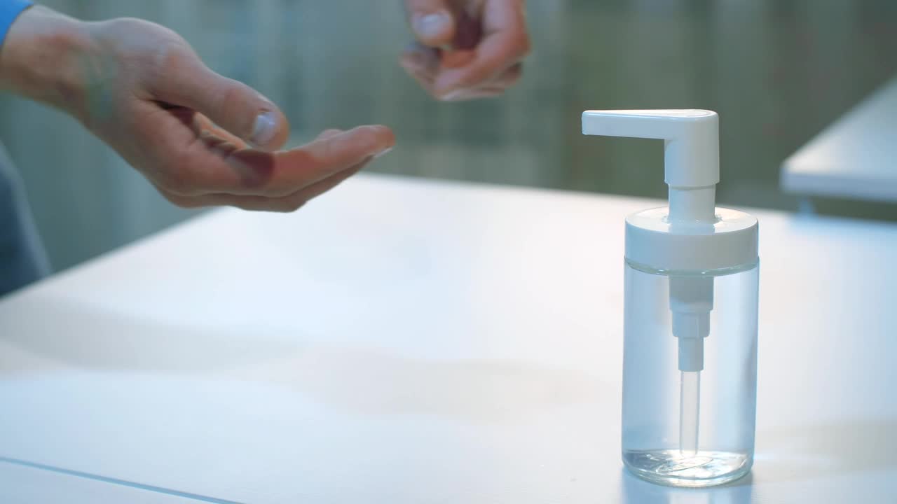 Video Stock Person Sanitizing His Hands With Gel Live Wallpaper Free