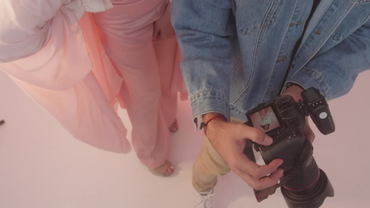 Video Stock Photographer And Model Reviewing Photos From A Shoot 41619Live Wallpaper Free