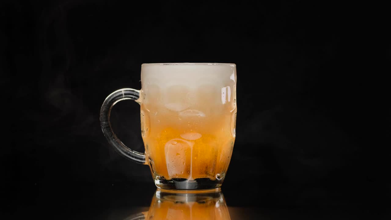 Video Stock Picking Up A Small Beer Mug On A Dark Background Live Wallpaper Free