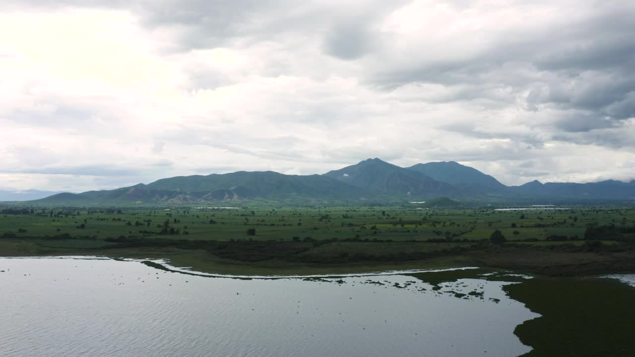 Video Stock Plain With A Lake Trees Grass And Hills In The Live Wallpaper Free