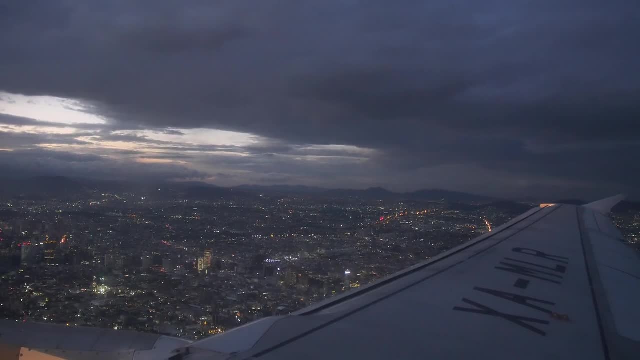 Video Stock Plane Flying Over A City At Night Live Wallpaper Free