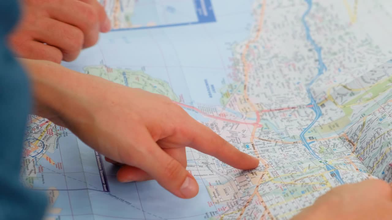 Video Stock Pointing To A Map Of A City With His Hands Live Wallpaper Free