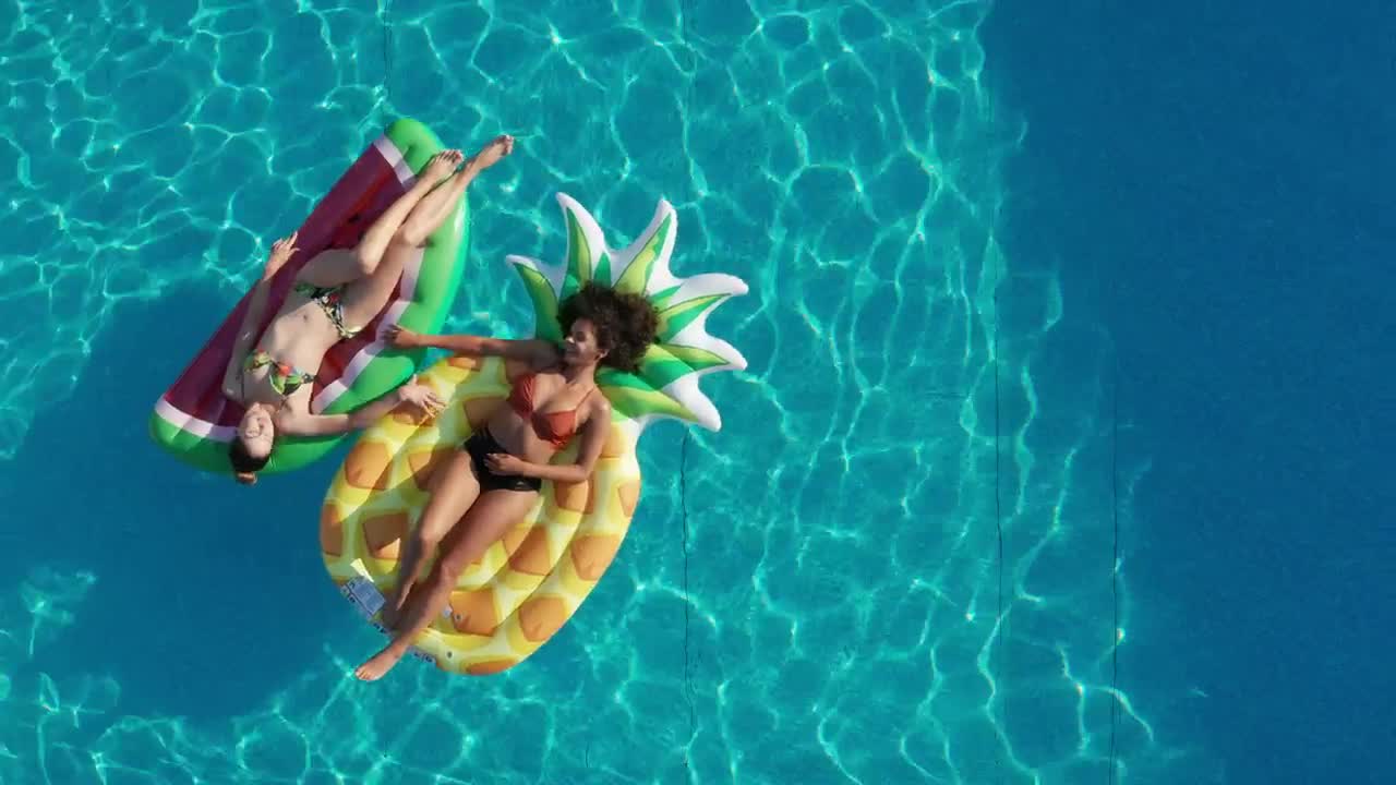 Video Stock Pool With Two Girls Lying On Floats Live Wallpaper Free