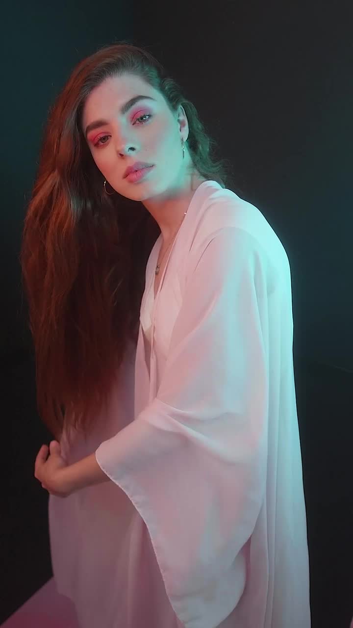 Video Stock Portrait Of A Girl Posing Captivatingly On Black Background Live Wallpaper Free