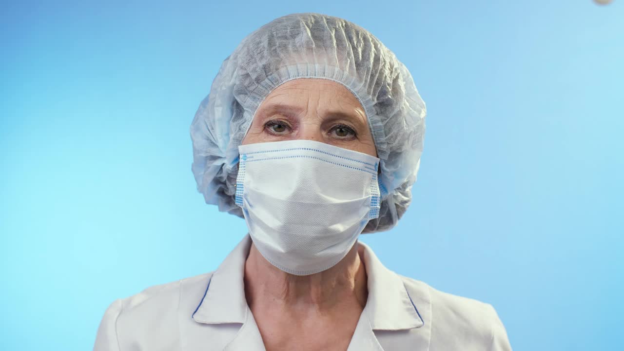 Video Stock Portrait Of An Adult Female Doctor On Blue Live Wallpaper Free