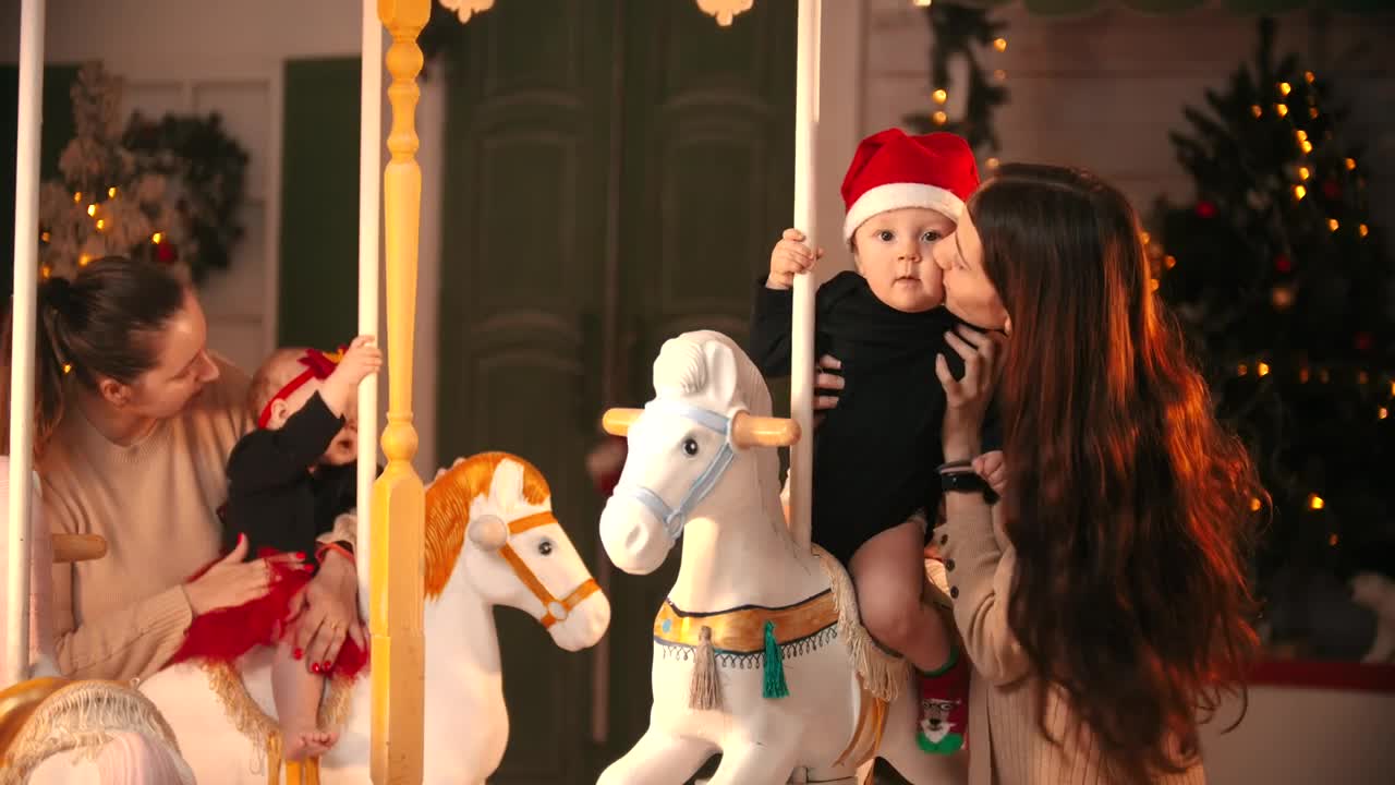 Video Stock Portrait Of Two Moms With Their Babies At A Carousel Live Wallpaper Free