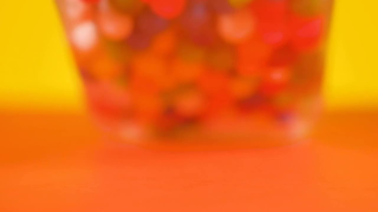 Video Stock Pot With Spilled Sweets On A Yellow Background Live Wallpaper Free