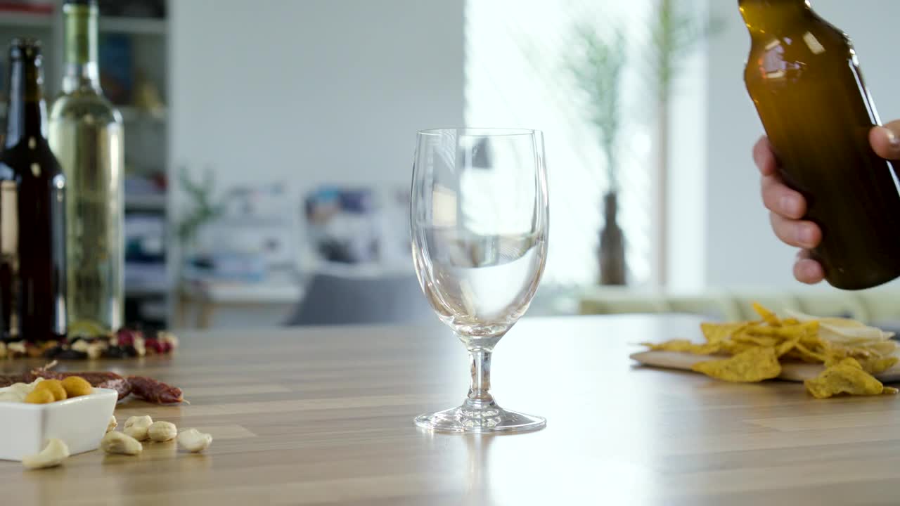 Video Stock Pouring Beer Into A Glass In The Kitchen Table Live Wallpaper Free