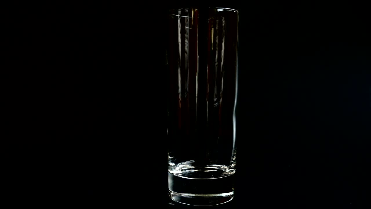 Video Stock Pouring Ice And Lemonade Into A Glass On Black Background Live Wallpaper Free
