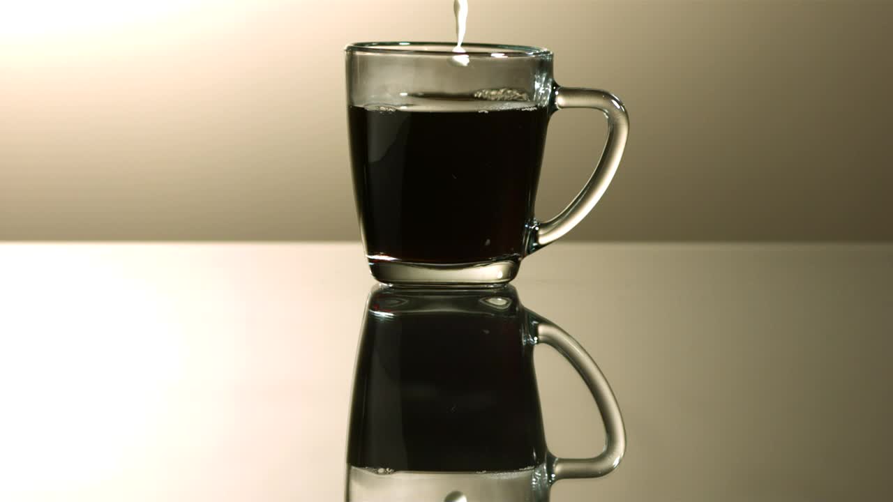 Video Stock Pouring Milk Into A Cup Of Coffee In Slow Motion Live Wallpaper Free
