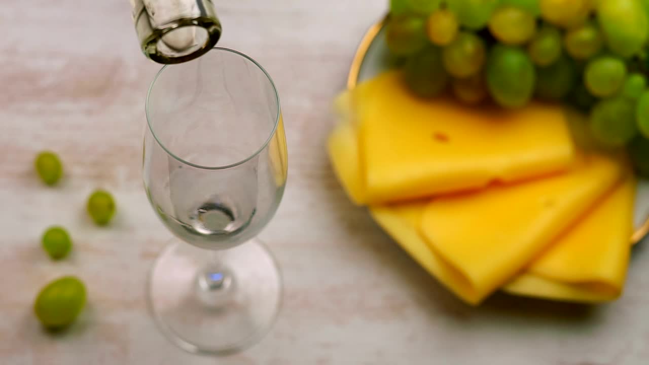Video Stock Pouring White Wine And A Plate Of Cheese Snacks Live Wallpaper Free