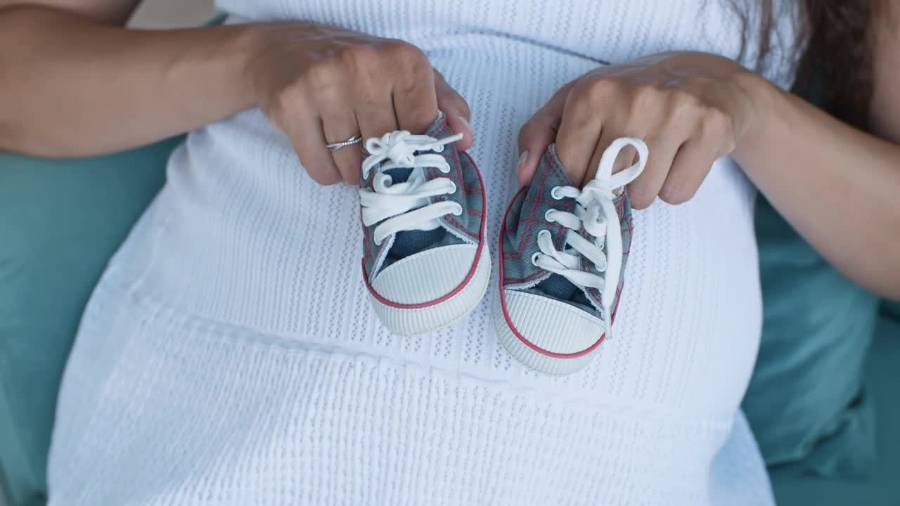 Video Stock Pregnant Woman Holding Small Baby Shoes Top Shot Live Wallpaper Free