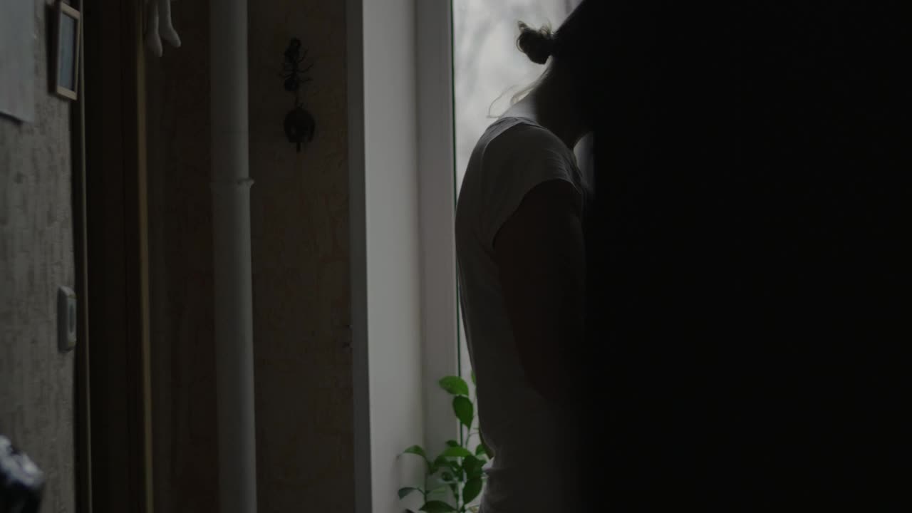 Video Stock Pregnant Woman Standing By A Window Live Wallpaper Free