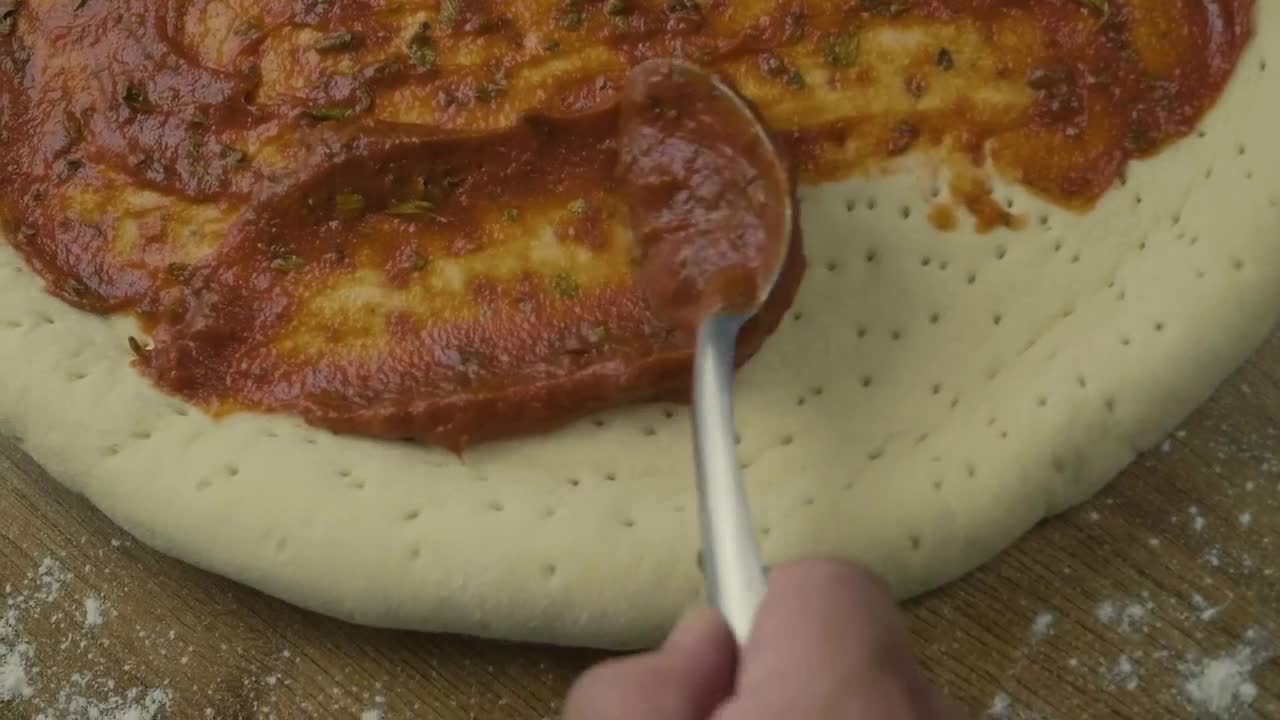 Video Stock Preparing A Pizza Dough Covering It With Salsa Live Wallpaper Free