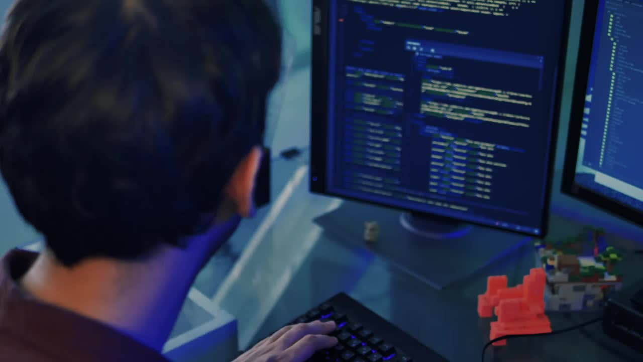 Video Stock Programmer Working With Codes On A Computer Live Wallpaper Free