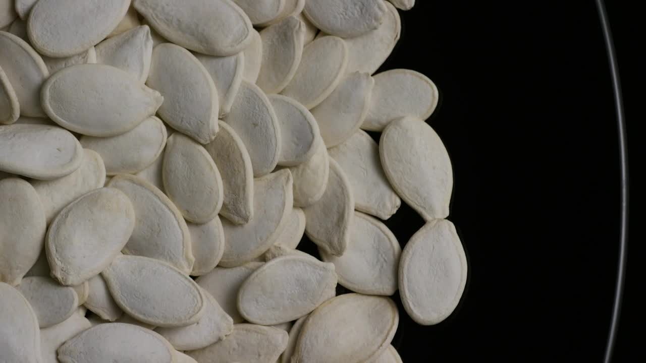 Video Stock Pumpkin Seeds On A Black Plate Live Wallpaper Free