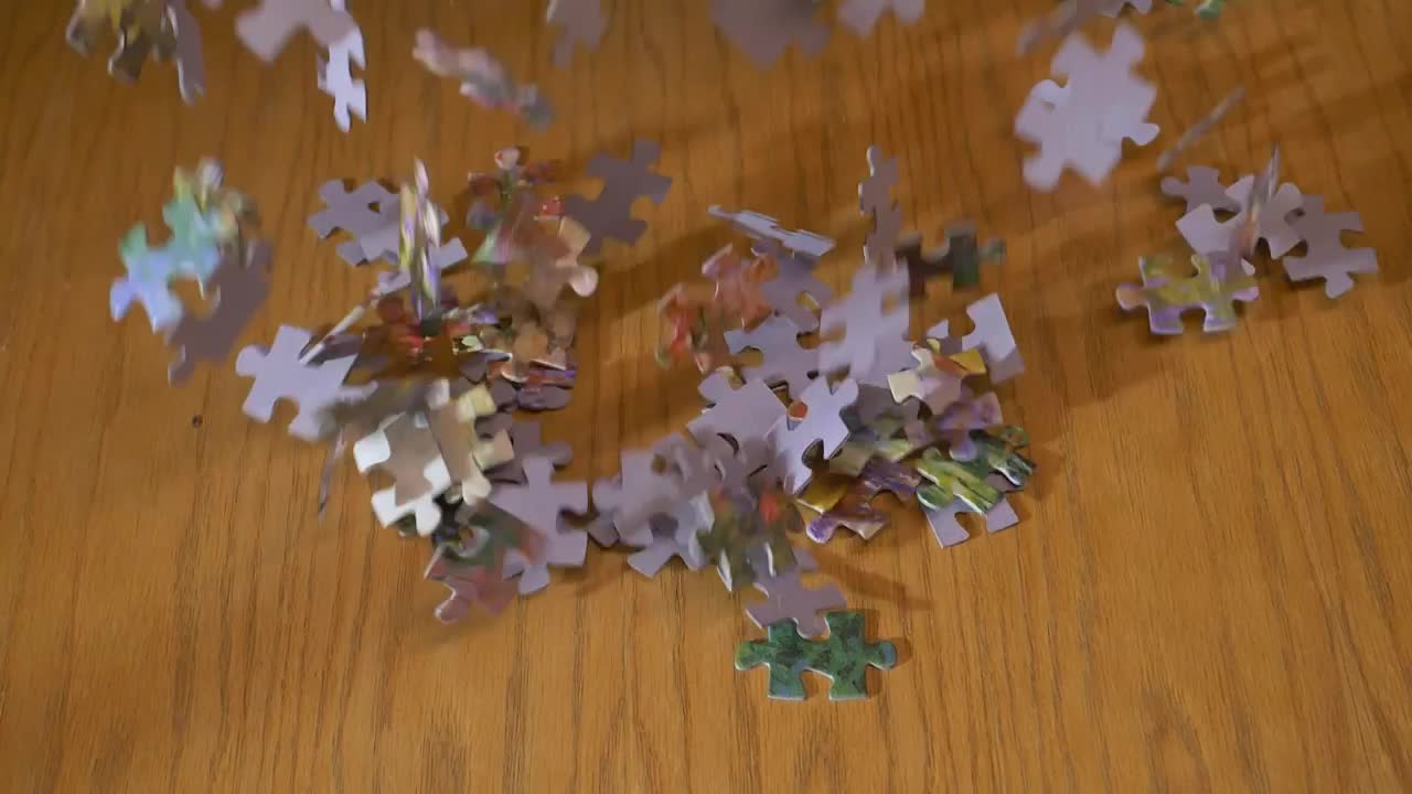 Video Stock Puzzle Pieces Falling On A Table Live Wallpaper Free