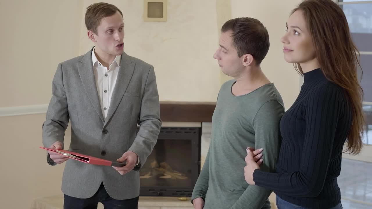 Video Stock Realtor Closes Sale Of House To Young Couple Live Wallpaper Free