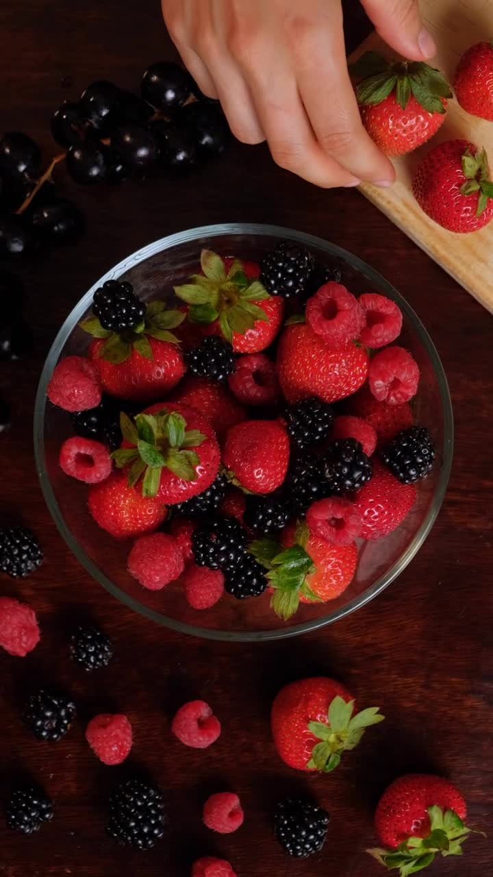 Video Stock Red Berries Served In A Bowl On A Wooden Table Live Wallpaper Free