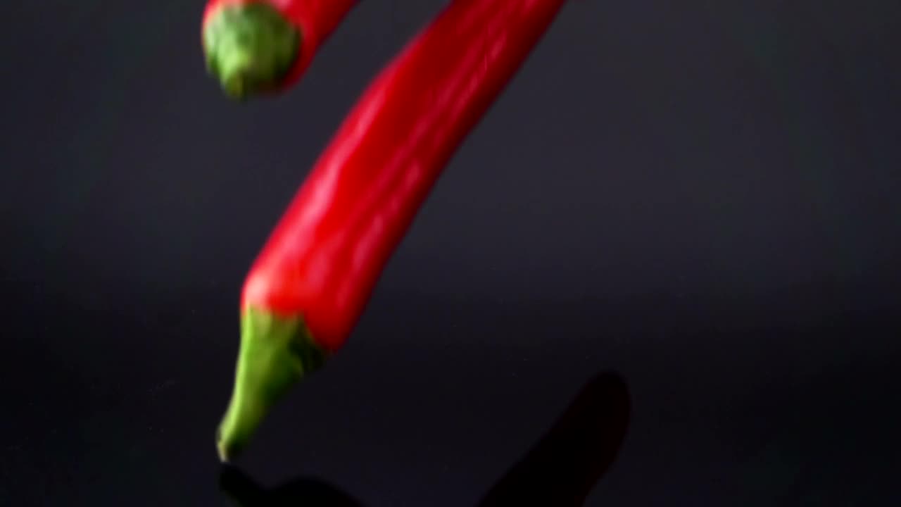 Video Stock Red Chili Pepper Falling Into Black Water Live Wallpaper Free
