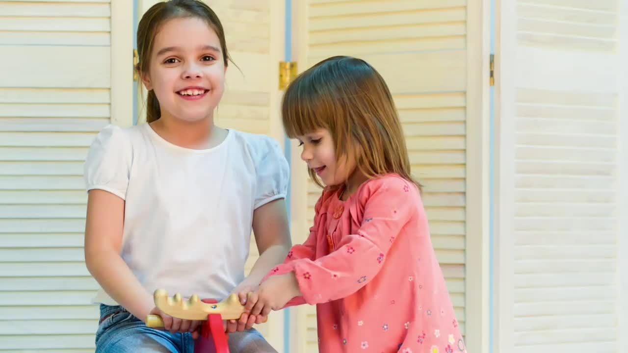 Free Stock Video Sisters Playing With A Rocking Horse Live Wallpaper