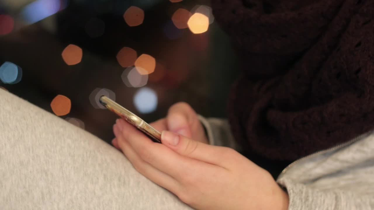 Free Stock Video Sitting By A Window Using A Phone Live Wallpaper