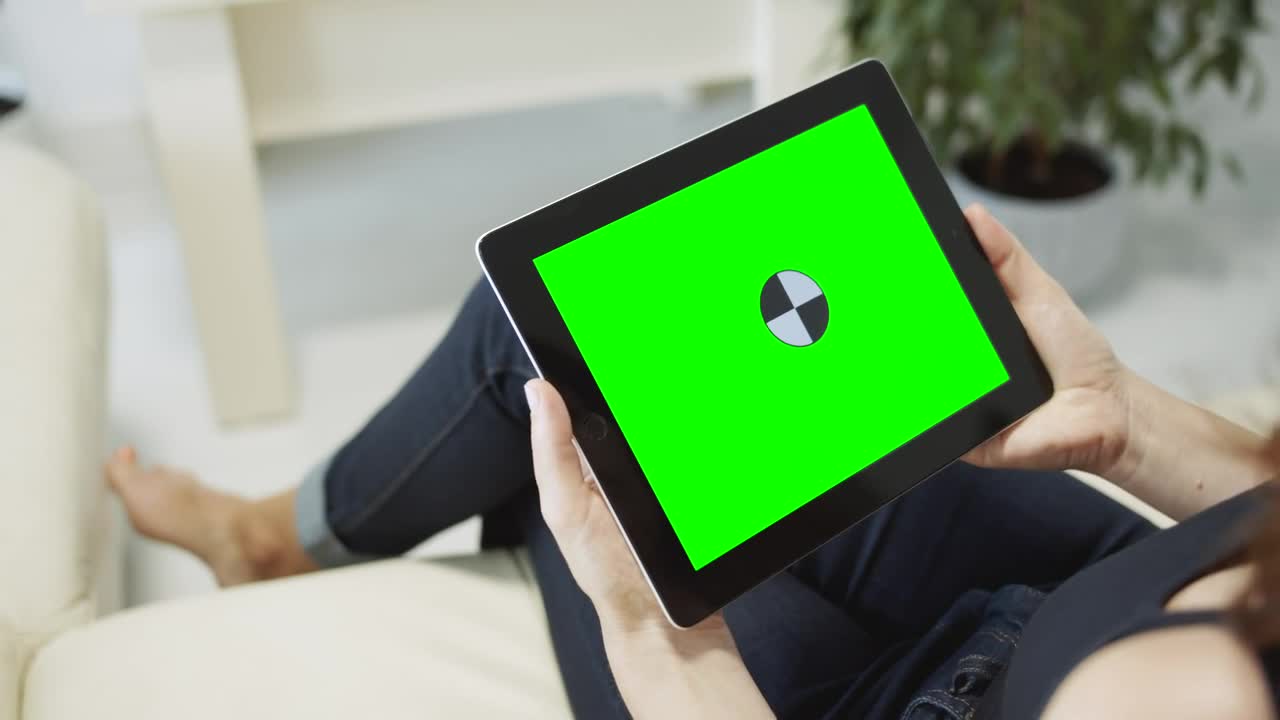 Free Stock Video Sitting On Sofa Browsing Web On Chroma Key Tablet Live Wallpaper