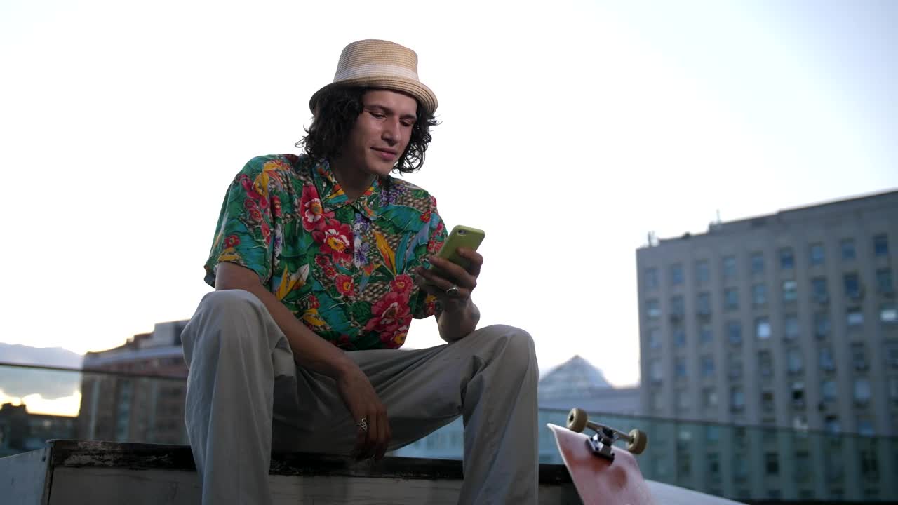 Free Stock Video Skateboarder Checking His Phone Live Wallpaper