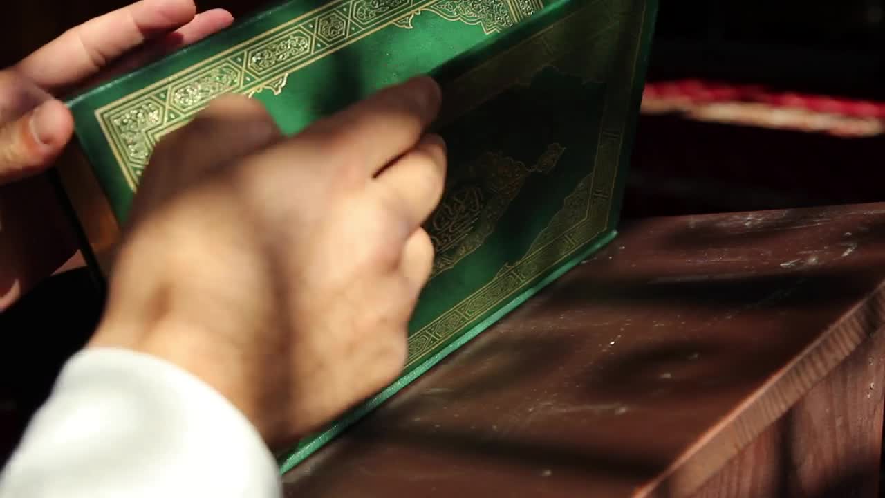 Free Stock Video Religious Man Looking At The Pages Of The Quran Live Wallpaper