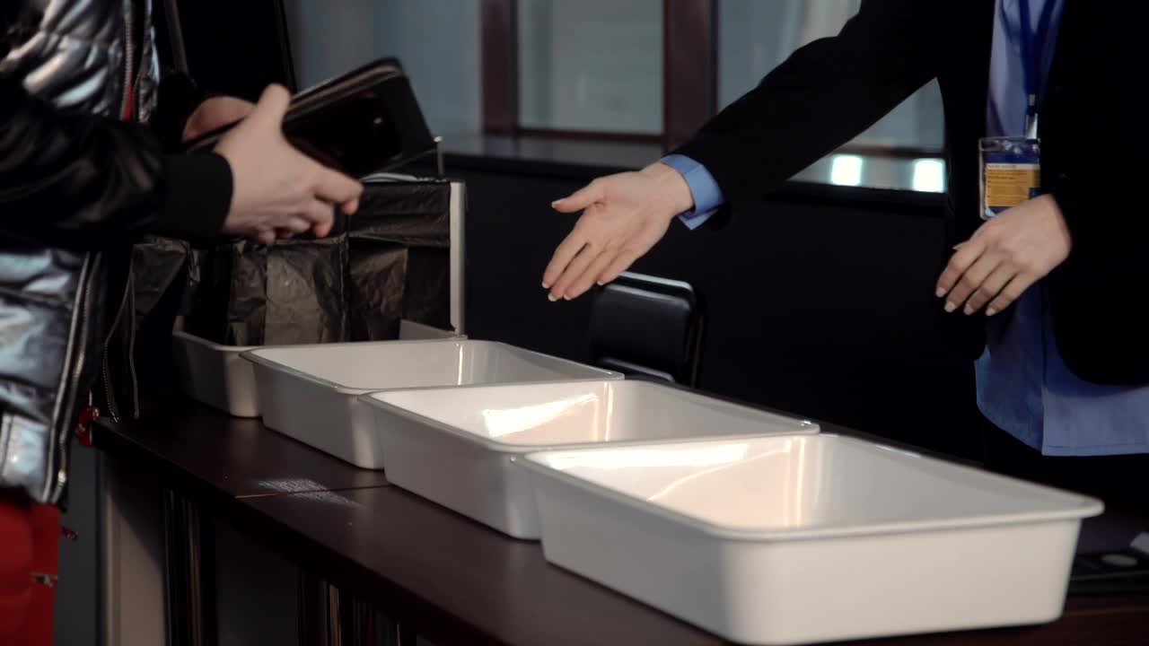 Free Stock Video Removing Personal Belongings At The Airport Live Wallpaper