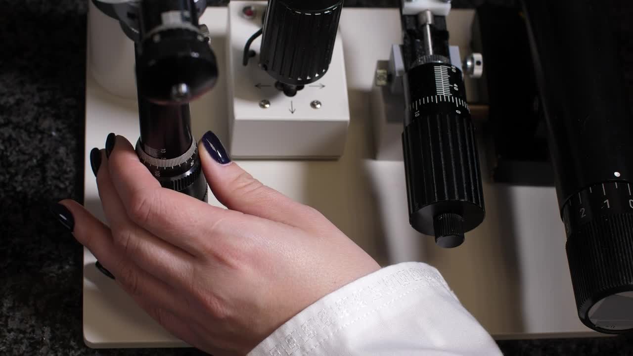 Free Stock Video Researcher Using A Microscope Zoom Live Wallpaper