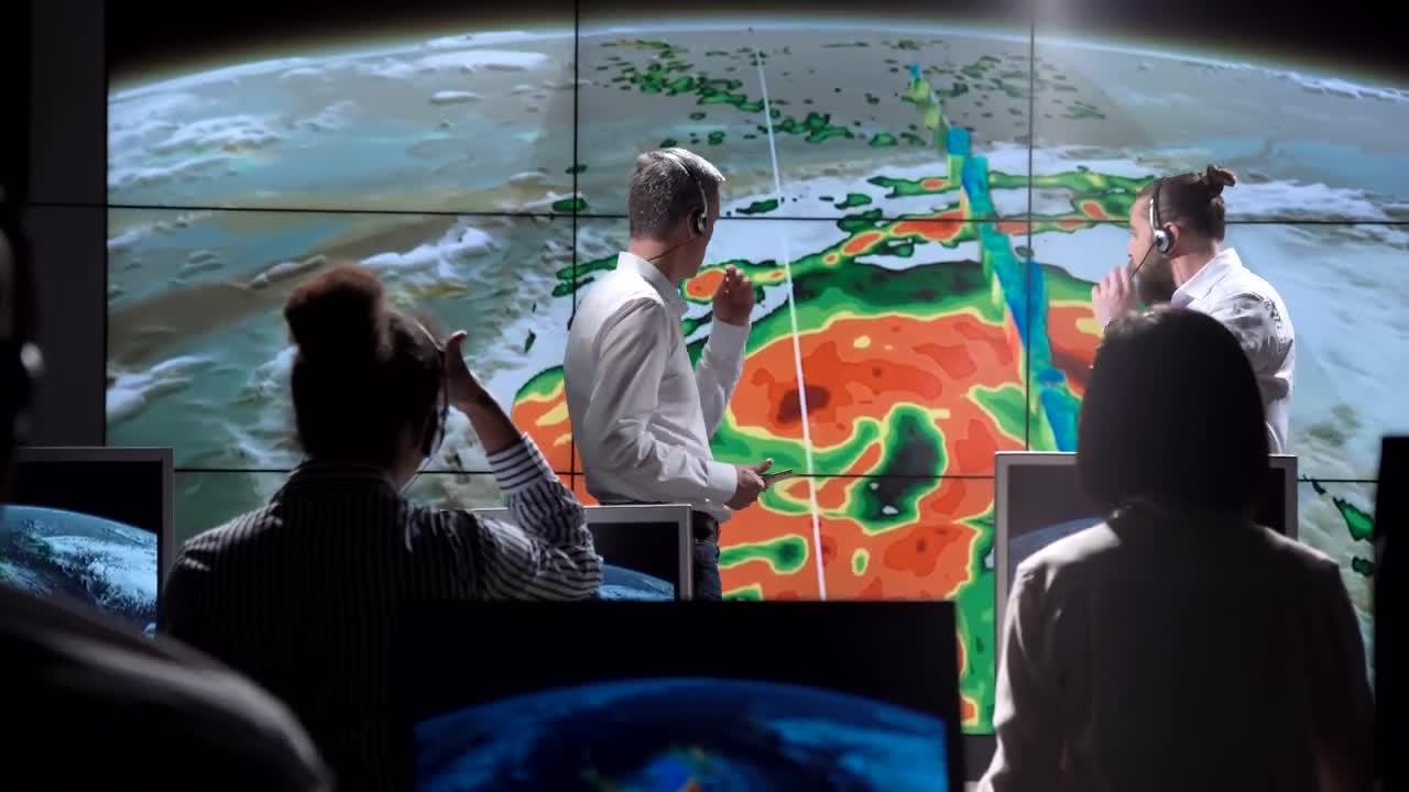 Free Stock Video Researchers Tracking Hurricane On The Monitor Live Wallpaper