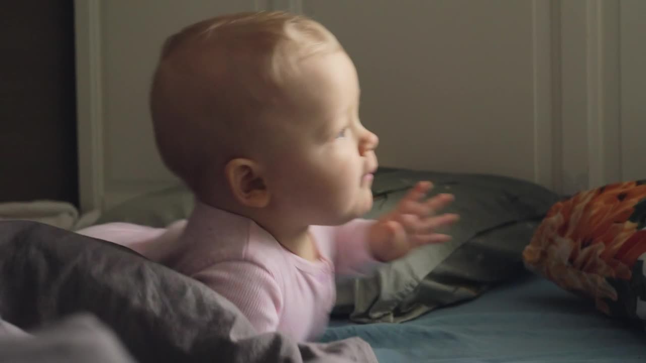 Free Stock Video Restless Baby Smiling At The Camera Live Wallpaper
