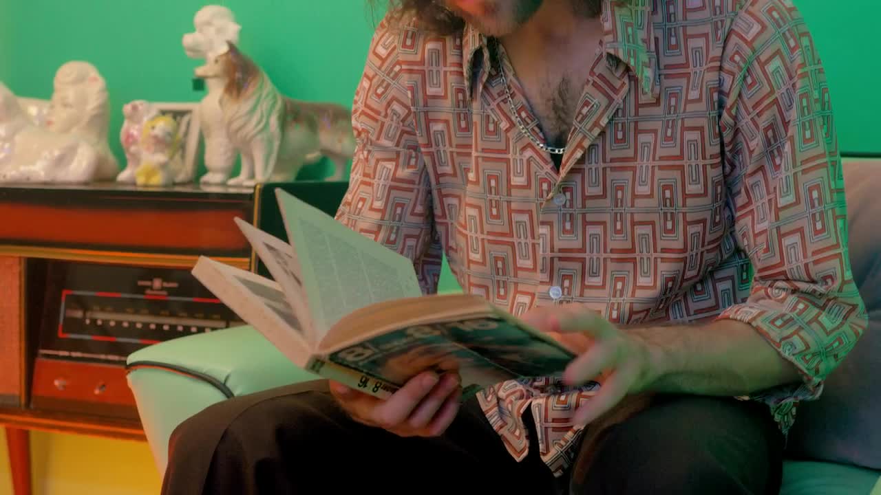 Free Stock Video Retro Man Sitting On Sofa Reading Book Live Wallpaper