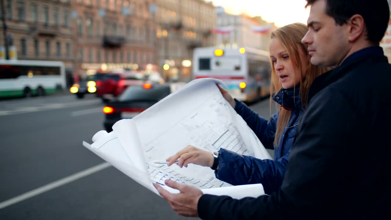 Free Stock Video Reviewing Building Plans In The Street Live Wallpaper