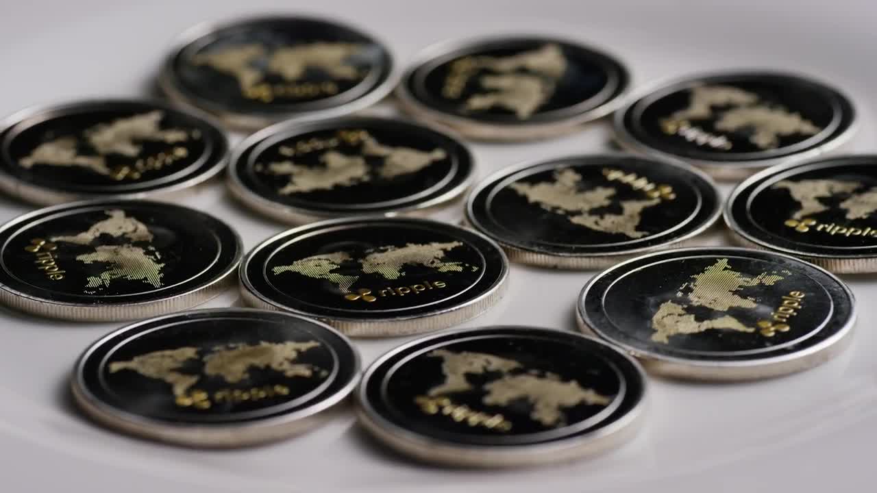 Free Stock Video Ripple Bitcoin Coins Rotating On A White Surface Live Wallpaper
