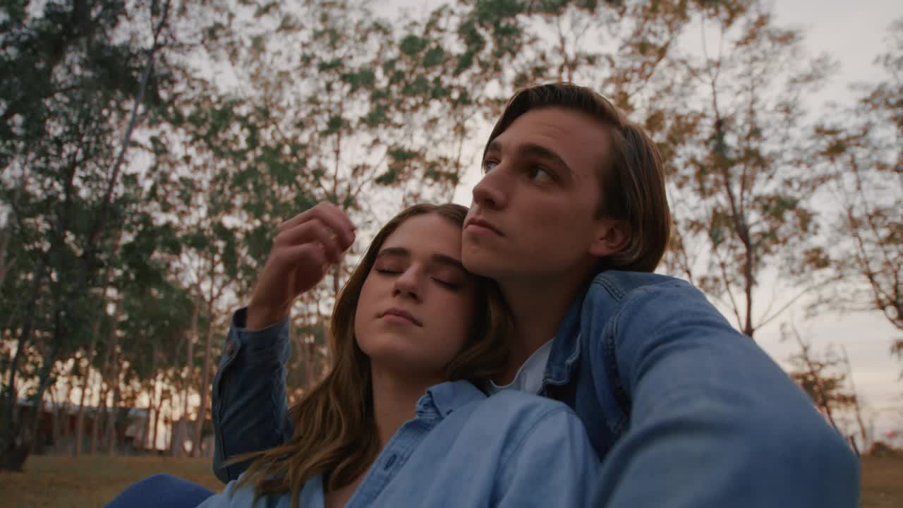 Free Stock Video Romantic Couple Sitting On The Grass In A Forest Live Wallpaper